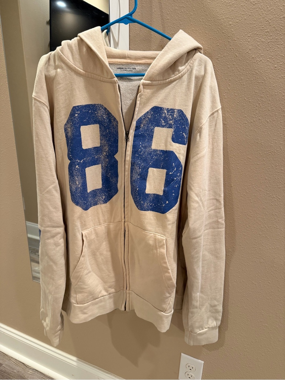 Never worn Urban Outfitters Beige Zip Hoodie with Blue '86' Graphic